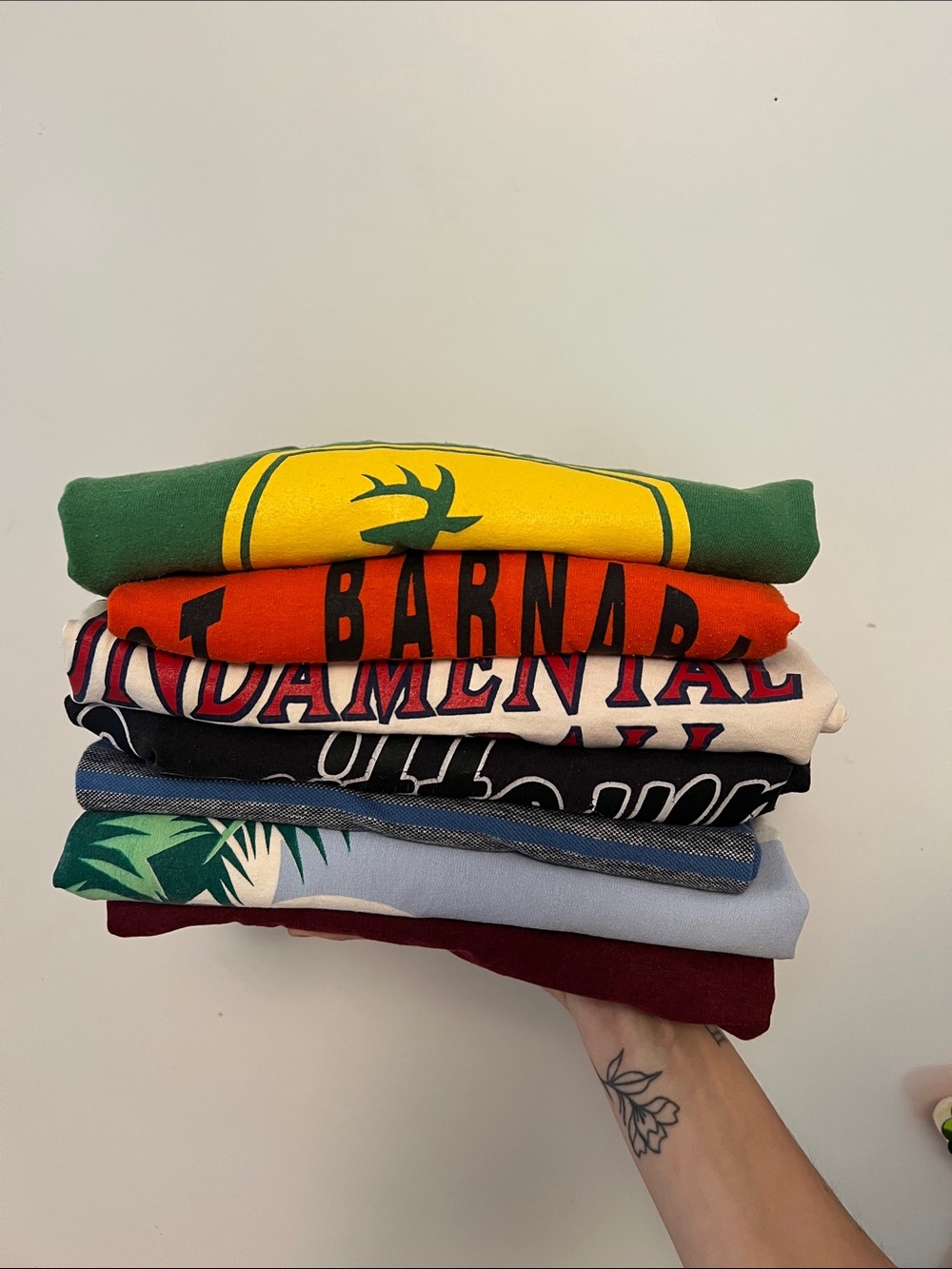 Stack of Men's Graphic Sweaters - Green, Yellow, Orange, Black, White, Blue, Red